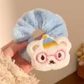 Detailed view of plush light blue scrunchie with cute embroidered bear doll ornament - White Bear Blue Scrunchie