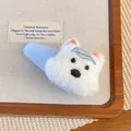 Detail of plush cartoon dog hair clip with blue bow and soft white faux fur texture - Side Clip
