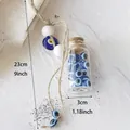 Handmade Evil Eye glass bottle hanging ornament with jute rope and white wooden beads - Blue Eye Bottle Hanging