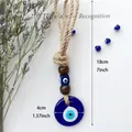 Detailansicht des handgefertigten Evil Eye Anhängers mit 4cm Glas-Nazar und Hanfseil - Klein (4CM) / Blau