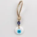 Evil eye charm with golden beads and white ceramic pendant on natural jute rope - White