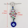 Hamsa hand and evil eye keychain with silver hook and size dimensions 13cm by 4cm - Carnation Floral Style 02