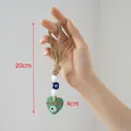Ciondolo malocchio fatto a mano con cuore di vetro verde e corda di iuta ornamentale - Cuore Verde