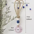 Rosa Wandbehang mit bösem Blick, handgefertigtem Juteseil und blauen Glasperlen - Rosa