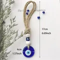 Handgefertigter Evil Eye Anhänger mit Glasperle und rustikalem Hanfseil, 17cm Gesamtlänge - Dunkelblau