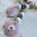 Pendaglio occhio del male rosa con perla da 4cm e corda in juta naturale da 18cm - Cerchio Rosa