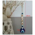 Bohemian evil eye wall hanging with white macrame cotton rope and blue glass charms - Evil Eye Hanging Ornament / Blue