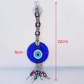 Decorazione da parete Occhio del male con vetro blu 6cm e corda intrecciata 22cm - Perline Multicolore