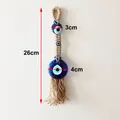 Handmade Evil Eye wall hanging with blue glass beads and jute rope, 26cm length - Evil Eye Hemp Rope Style