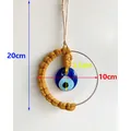 Decorazione da parete occhio del diavolo con corda gialla e telaio da 10cm - Caramello