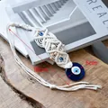 Handmade macrame evil eye wall hanging with white cotton ropes and blue glass bead - Style B