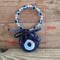 Ciondolo da parete malocchio in vetro blu con perline e fiocco, lunghezza totale 10 cm - Blu