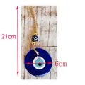 Blue Evil Eye glass pendant wall hanging with golden beads and jute rope, 21cm length - 6cm Diameter Blue Eye
