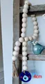 Boho wood bead garland with blue Evil Eye glass pendant and rustic jute tassel - Wood Bead Wreath Hanging