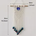 Bohemian evil eye woven tapestry wall decor with blue bead and cotton fringe accents - Blue Eye Wolf Style