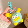 Cute mint green plush monster keychain with yellow accents and colorful letter beads - Green