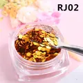 Détail macro de paillettes dorées hexagonales avec cuillère métal en pot transparent - Jaune d'Or (RJ02)