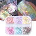 Macro detail of iridescent aurora nail glitter flakes in a 6-compartment storage box - Opal Sequins (OB)