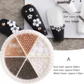 Set nail art 3D avec perles or rose, gris foncé et fleurs blanches en boîte 6 cases - Style A