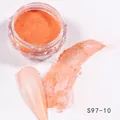 Macro detail of vibrant orange metallic nail glitter powder in a diamond-shaped jar - Bright Orange Shimmer (S97-10)