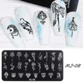 Macro detail of MJ-08 nail stamping plate with bohemian patterns and finished nail art designs - Mandala Moon Bohemian Style (MJ-08)