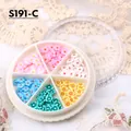 Dettaglio di fiori colorati in pasta polimerica 3D per nail art in una scatola a sei scomparti - Stile Misto Fiori (S191-C)