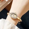 Vintage oval gold bangle watch with diamond bezel and Roman numerals for women - All Gold