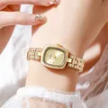 Luxury women's square gold watch with metallic chain bracelet and radiant dial on wrist - All Gold
