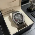 Detail of industrial TENTWO men's watch with red splatter dial and grey silicone strap - Gray
