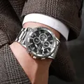 Men's business chronograph watch with steel strap and black dial on a suit sleeve - Silver Black