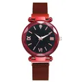Close-up of bright red mesh strap watch with starry black dial and faceted glass crystal - Red