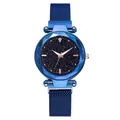 Close-up of starry blue dial with geometric cut glass and magnetic mesh band - Blue