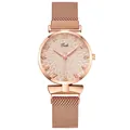 Detail of rose gold Tadi watch dial with textured relief and Milanese mesh band - Off White
