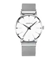 Détail de la montre Geneva avec bracelet en maille argentée et cadran blanc épuré - Boîtier Argent Bracelet Argent Cadran Blanc Aiguilles Noires