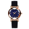 Women's rose gold quartz watch with starry sky dial and black leather strap on white background - Black