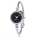 Detailed close-up of a silver bangle watch with a black dial and quartz movement - Index Black Face