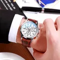 Business men's quartz watch with silver case, white dial, and brown leather strap on wrist - White Dial Brown Strap