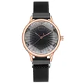 Detailed macro of the Tadi rose gold dial with crystal markers and sunray pattern - Black
