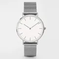 Detail of silver Milanese mesh strap and minimalist white dial on quartz watch - Silver Case White Dial