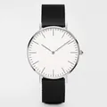 Close-up of minimalist silver quartz watch with white dial and black mesh band - Black Strap Silver Case White Dial