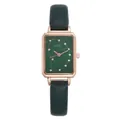 Close-up of a rectangular green watch face with gold spiral patterns and crystal markers - Green