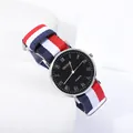 Minimalist quartz watch with blue-light Roman numeral dial and colorful nylon NATO strap - Black Dial Blue White Red Strap