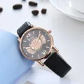 Macro detail of the rose gold dial featuring a cute cartoon motif and black leather strap - Black