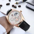 Detailed macro view of white dial featuring sun-moon phase and skeletal mechanical movement - Rose Gold Case White Dial Black Strap