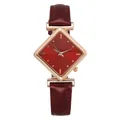 Macro detail of wine red leather strap and diamond-shaped quartz watch dial - Red