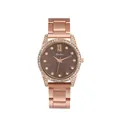 Détail d'une montre en or rose avec strass brillants et cadran marron à vagues - Café