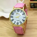 Detail of pink leather strap and gold watch case with a white numeric dial face - Pink