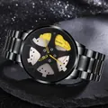 Detailed macro view of the black sports watch dial featuring a yellow racing hub design - Yellow