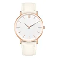 Detail of rose gold watch case with minimalist white dial and cream leather strap - White