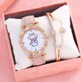 Detailed macro view of elegant pink leather watch and star charm bracelet in gift box - Pink + Bracelet + Box